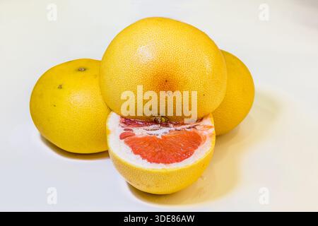 Yellow Pomelo with sliced isolated on white background. Clipping path. Stock Photo