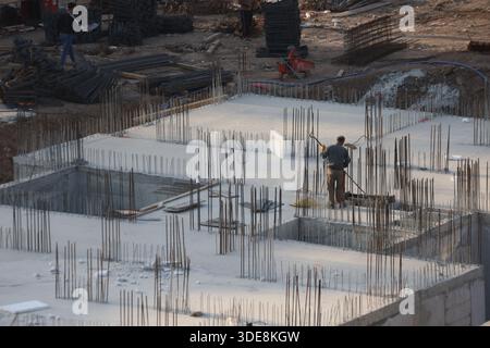 Reinforced concrete foundations under construction. Concrete foundation with vertical steel rebars Stock Photo