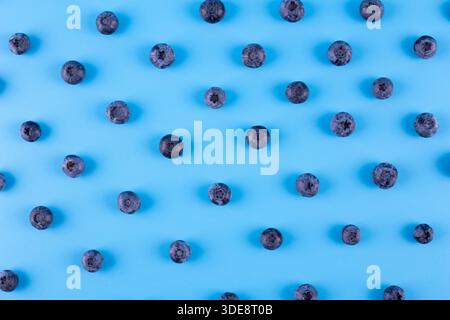 Blueberry isolated on blue background. Blueberries background. Healthy, natural fruit. Vegan and vegetarian concept. Summer healthy food. Stock Photo