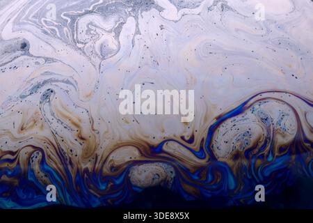 Colorful abstract liquid pattern with swirling blue, brown, and cream shades. High-resolution background perfect for creative and commercial design pr Stock Photo