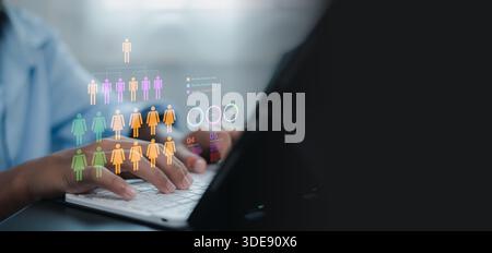 Close up of HR manager hands using laptop with virtual holographic icons of people and organizational structure. Concept of human resources, recruitme Stock Photo