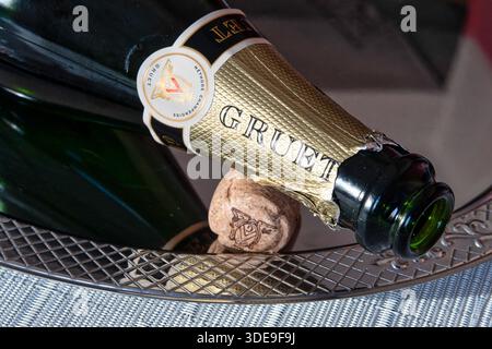 Close-up of an empty Gruet sparkling wine bottle and cork on a silver tray, 2025, United States Stock Photo