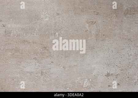 Light concrete surface features a textured finish with subtle variations, ideal for backgrounds in various design projects Stock Photo