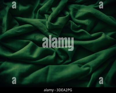 A crumpled green fabric background. Close up. Stock Photo