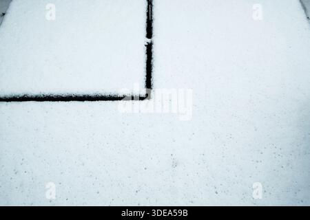 Abstract patterns in the snow on garden furniture Stock Photo