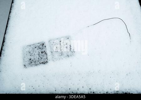 Abstract patterns in the snow on garden furniture Stock Photo
