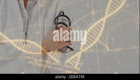 Holding stethoscope to chest, doctor in white lab coat and light shirt in lab, DNA graphics Stock Photo