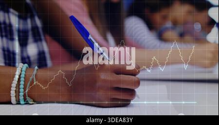 Writing right hand wearing bracelets holding blue pen on lined paper in class, plaid shirt, overlay Stock Photo