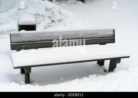 Snowy outdoor weather during day and nixie tube clock indoors Stock Photo