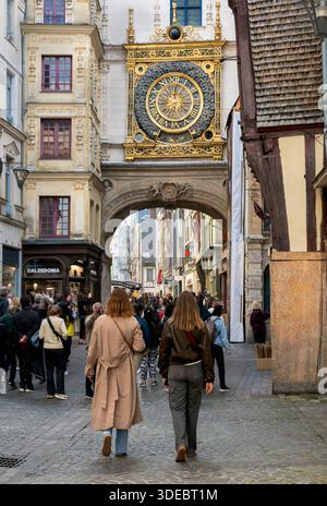 People walk under the Gros-Horloge (Great Clock) in Rouen, Normandy, France Stock Photo