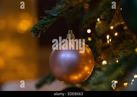 Christmas-tree decoration bauble on decorated Christmas tree Stock Photo