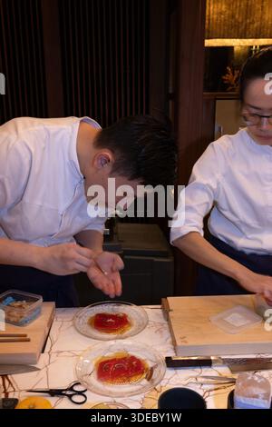 A chef at Tobi Masa, the exclusive Japanese restaurant within The Chancery Rosewood Hotel in London's Mayfair prepares a Tuna Carpaccio Stock Photo