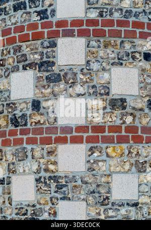 Curved wall made of stone, bricks and seashells, Hauts-de-France, France Stock Photo
