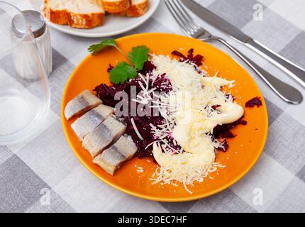 Beetroot served with cheese and pickled mackerel Stock Photo