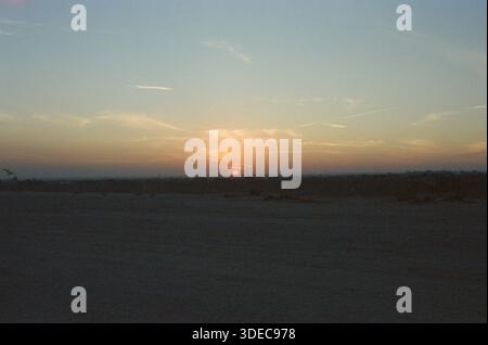 Sun Setting over desert in Saudi Arabia Stock Photo
