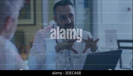 Explaining physician in white coat with stethoscope reviewing results in clinic with laptop charts Stock Photo