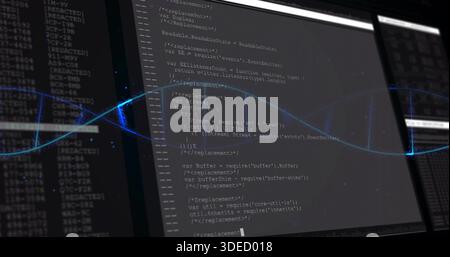 Displaying central monitor showing JavaScript code in dim workstation, with blue DNA helix overlay Stock Photo
