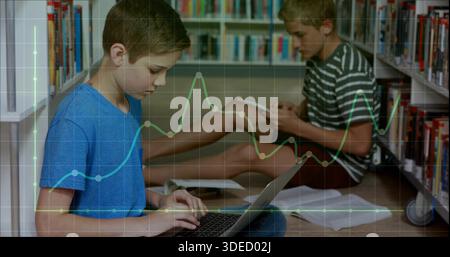 Typing two boys in blue striped shirts using laptop and tablet in library, with graph overlay Stock Photo