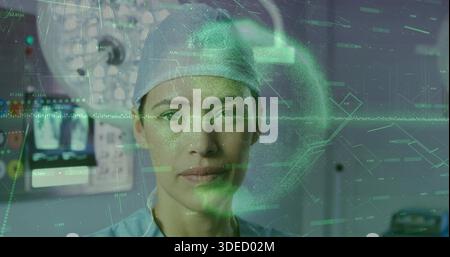 Facing female surgeon wearing surgical cap and blue scrubs in OR, displaying green AR monitor Stock Photo