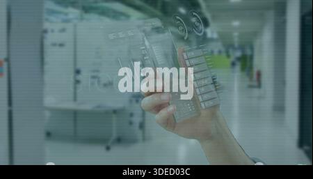 Holding hand showing transparent phone with holo UI charts, shirt cuff visible in office green wall Stock Photo