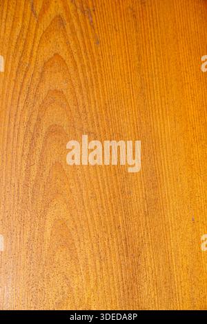Close-up of natural wood grain texture with warm golden-brown tones for background and interior design. Stock Photo