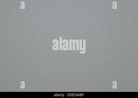 Light gray textured wallpaper background with a subtle embossed pattern, ideal for interior design and minimalist backdrops. Stock Photo