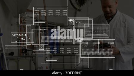 Inspecting senior technician in lab coat using tablet by tanks with HUD overlays, copy space Stock Photo