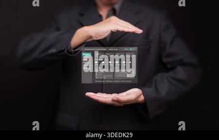 Businessman holding and protecting enterprise AI control center interface. Secure automation, data governance, workflow access, agentic enterprise, an Stock Photo