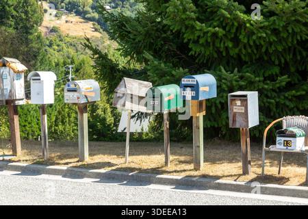 A quirky collection of homemade mailboxes Arthurs Point, Queenstown, Otago, New Zealand Stock Photo