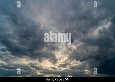 Dark gloomy clouds on a stormy sky. Natural atmospheric background. Stock Photo