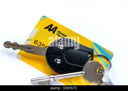 London. UK- January 05.2026. A close up of an AA roadside vehicle assistance membership card and a car key isolated on white. Stock Photo