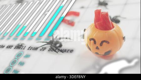 Sitting orange jack-o'-lantern on right side of printed sheet, with red filler pins, copy space Stock Photo