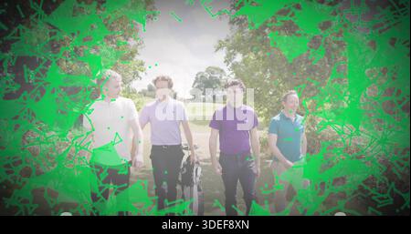 Walking four men wearing polo shirts strolling along golf fairway, with golf bag and clubs Stock Photo