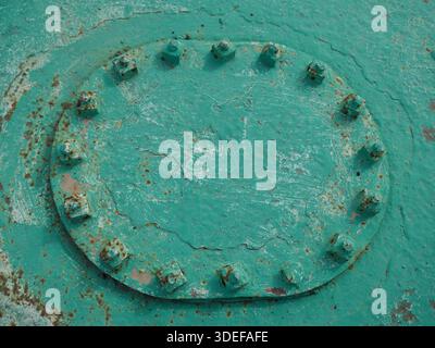 Heavy duty metal utility access panel painted green Stock Photo
