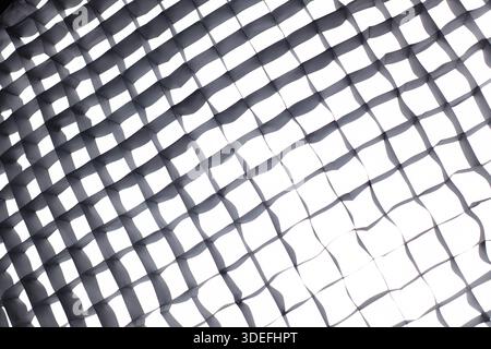 Softbox grid texture with light. Studio softbox grid texture with diffused light, abstract lighting pattern for photography, cinema and design backgro Stock Photo