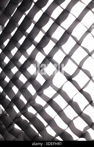 Fabric honeycomb for softbox. Abstract softbox grid pattern with light and shadow, geometric texture background. Stock Photo