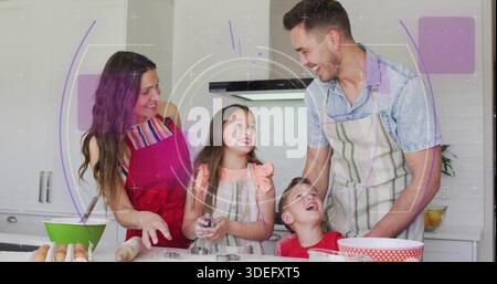 Preparing family baking cookies at kitchen counter, mother in red apron, metal cutters, rolling pin Stock Photo
