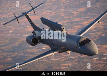 The image depicts a Hellenic Air Force Embraer EMB-145H AEW&C Erieye aircraft flying in an air-to-air demonstration at Athens Flying Week 2025. Registration 729, serial 145729, operated by the 380 Mira Squadron. Twin-engine jet powered by Rolls-Royce AE 3007A turbofans with pressurized fuselage, dorsal radar, wing fuel tanks, and tail vertical stabilizer. The photograph highlights the aircraft’s operational surveillance, command and control functions, and air-to-air display performance. Stock Photo
