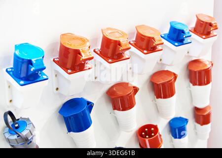 CEE electrical power connectors on the stand in the store at the exhibition Stock Photo