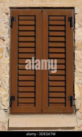 Wooden window shutters on a house Stock Photo