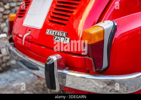 Belgrade, Serbia,13.06.22. Zastava 750 (Fico), red classic Yugoslavian supermini vintage car in Belgrade, Serbia, close-up back view with logo. Stock Photo