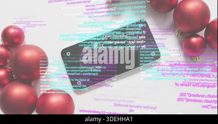 Lying black smartphone reflecting colorful code overlay on white tabletop, with red ornaments Stock Photo