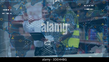 Pointing manager in tie and hi-vis vest worker checking stock on tablet at warehouse with overlay Stock Photo