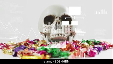 Showing off white skull model resting centered on tabletop, framing foil candies and data overlays Stock Photo