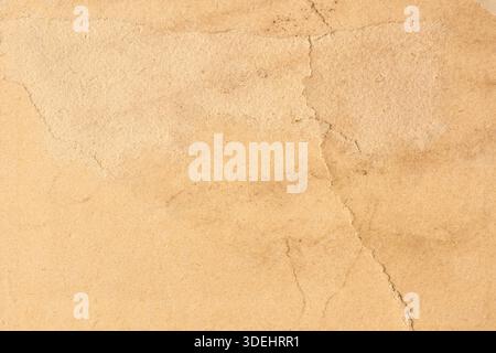 old vintage paper on full frame surface, weathered grainy texture with warm beige matte finish and visible fibers copy space historical background Stock Photo