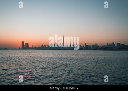 Dubai skyline panoramic silhouette with Burj Khalifa at sunset Stock Photo