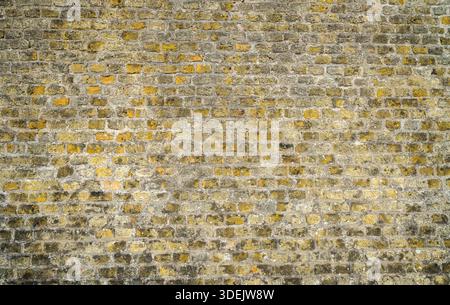 Rustic wall in beige-brown tones. Brick wall as a background. Stock Photo
