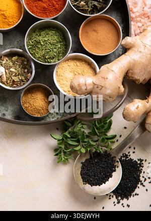 Many different spices. A collection of various spices and herbs on a light background. Top view. Stock Photo