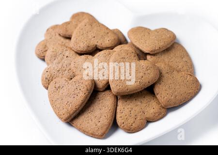 Heart-shaped gingerbread cookies isolated on white background Stock Photo