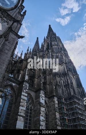 A vertical low angle shot of the Cologne Cathedral in Germany against ...